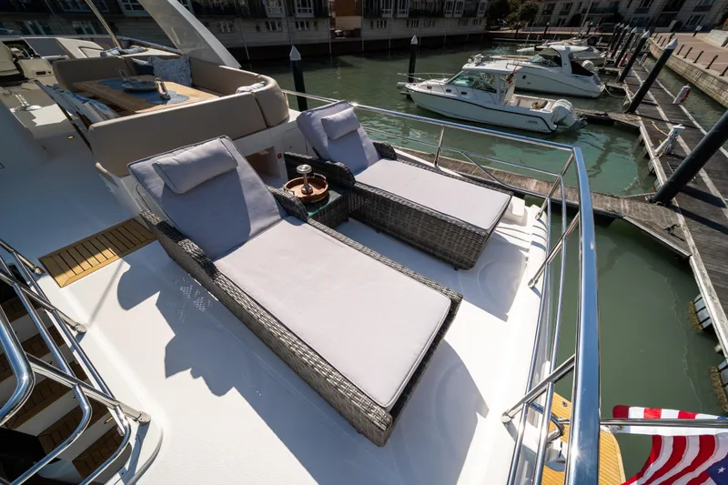 Slide: The Image of Luxurious 2018 Absolute 58 Navetta yacht with sun loungers and marina view. - 39