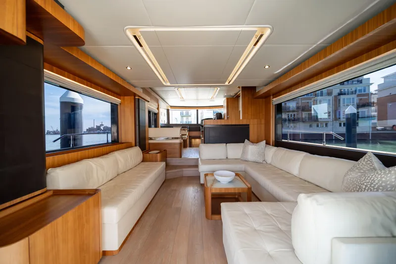 Slide: The Image of Luxurious interior of 2018 Absolute 58 Navetta yacht with elegant seating and large windows. - 41