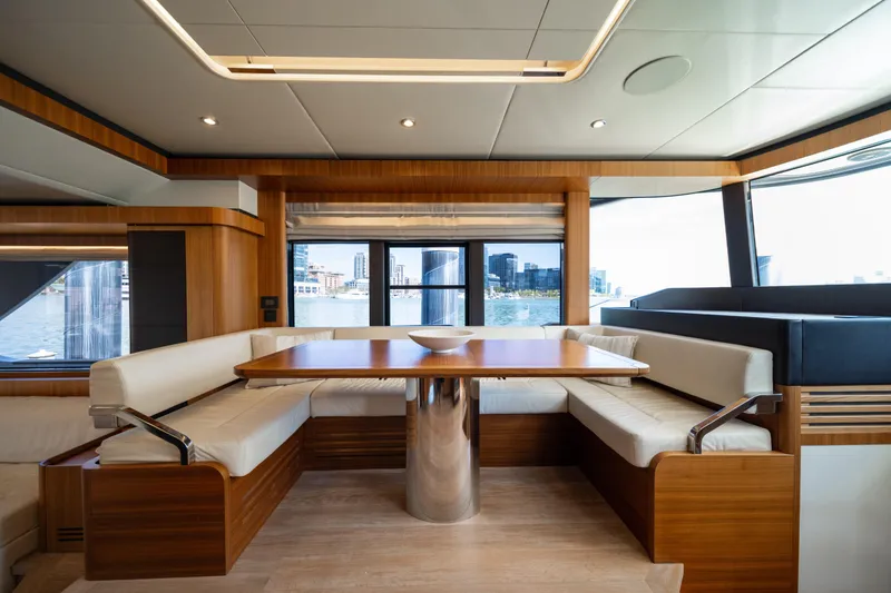 Slide: The Image of Luxurious interior of 2018 Absolute 58 Navetta yacht with elegant dining area and waterfront view. - 46