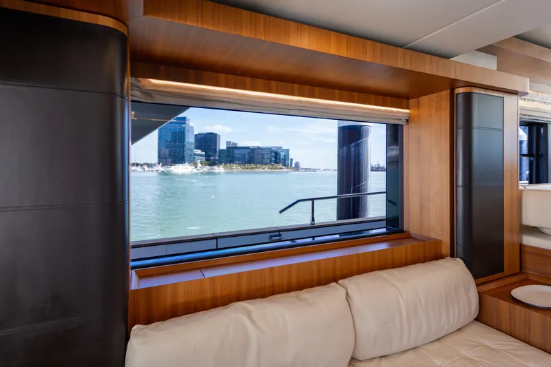 Slide: The Image of Luxurious interior view from 2018 Absolute 58 Navetta yacht, showcasing waterfront cityscape. - 47