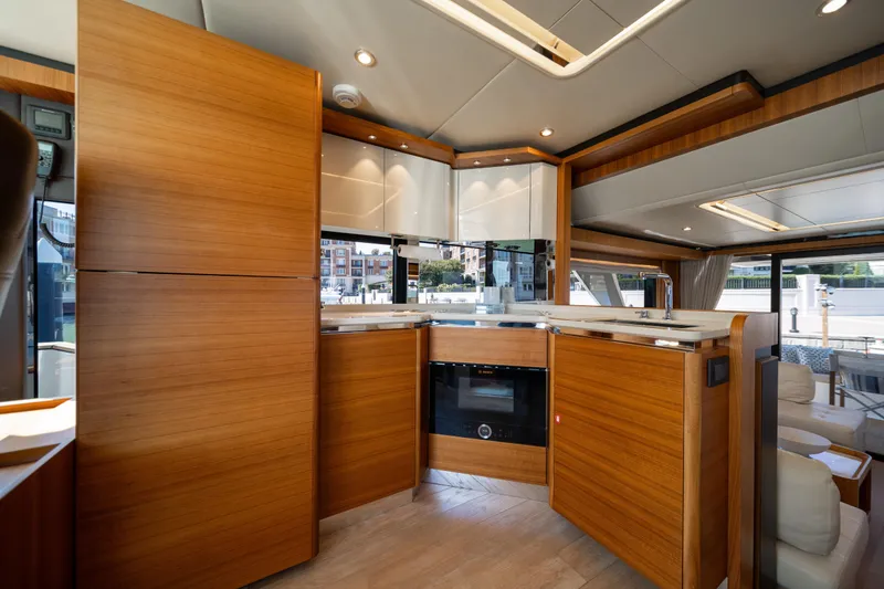 Slide: The Image of Luxurious kitchen interior of 2018 Absolute 58 Navetta yacht with modern wood finish. - 50