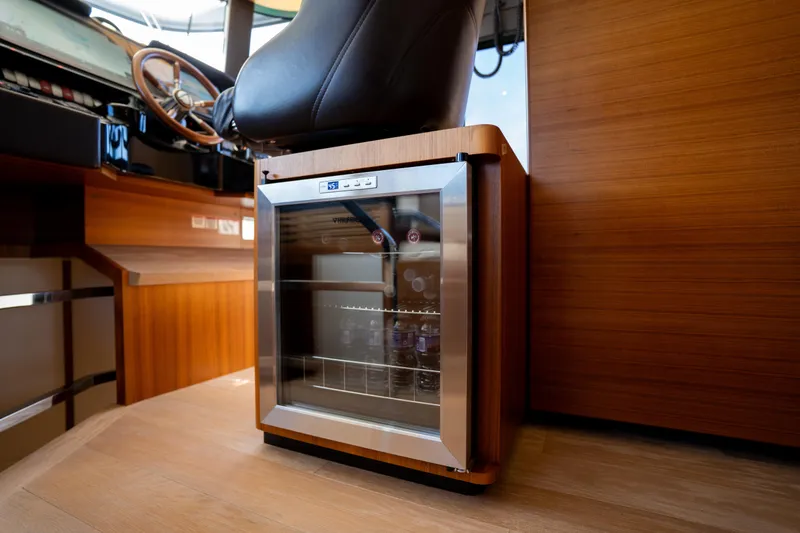 Slide: The Image of Mini fridge in the helm area of a 2018 Absolute 58 Navetta yacht. - 54