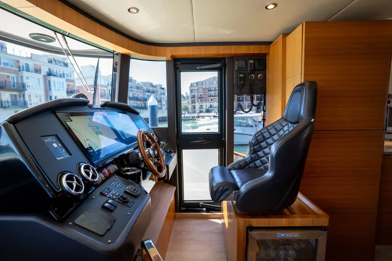 Slide: The Image of Luxurious helm of 2018 Absolute 58 Navetta yacht with modern controls and leather seating. - 55