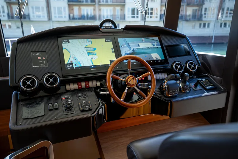 Slide: The Image of Cockpit of 2018 Absolute 58 Navetta yacht with advanced navigation controls and displays. - 56