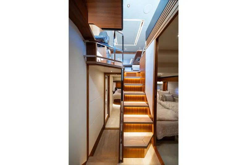 Slide: The Image of Luxurious interior of 2018 Absolute 58 Navetta yacht with illuminated wooden staircase. - 57