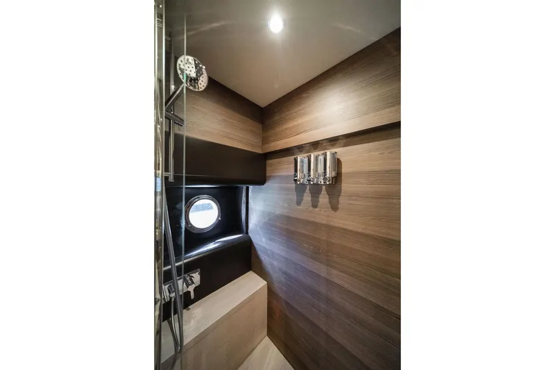 Slide: The Image of Luxurious bathroom interior of 2018 Absolute 58 Navetta yacht with modern wood paneling. - 64