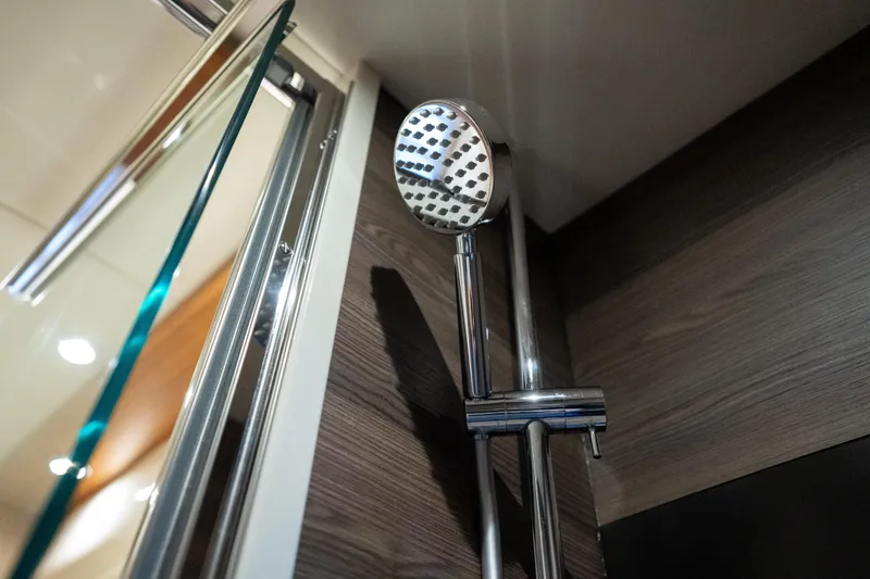 Slide: The Image of Showerhead in 2018 Absolute 58 Navetta yacht bathroom, featuring modern chrome design. - 67