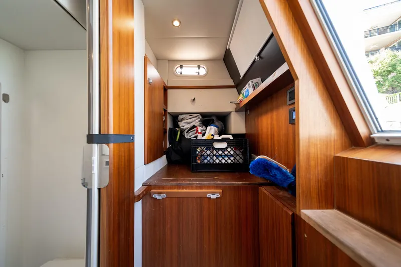 Slide: The Image of Interior of 2018 Absolute 58 Navetta yacht with wooden cabinetry and storage area. - 72