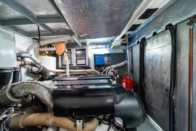 Slide: The Image of Engine room of 2018 Absolute 58 Navetta yacht, showcasing machinery and equipment. - 77