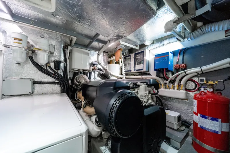 Slide: The Image of Engine room of 2018 Absolute 58 Navetta yacht, showcasing machinery and equipment. - 79