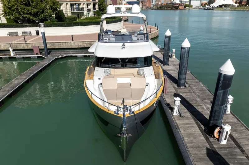 Slide: The Image of Luxury Absolute 58 Navetta yacht docked in marina, 2018 model. - 8