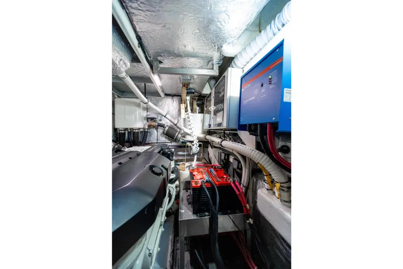 Slide: The Image of Engine room of 2018 Absolute 58 Navetta yacht, showcasing machinery and control systems. - 80