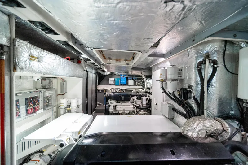 Slide: The Image of Engine room of 2018 Absolute 58 Navetta yacht, showcasing machinery and equipment. - 81