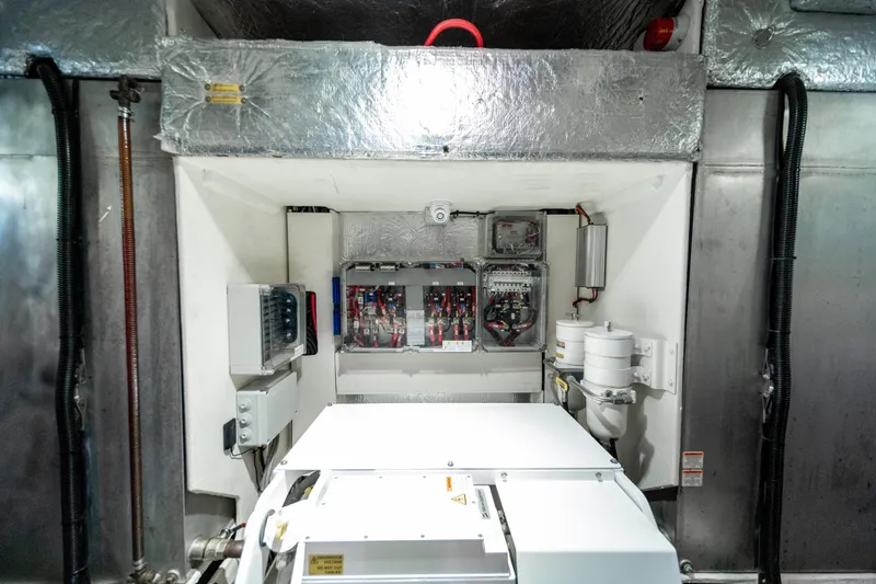 Slide: The Image of Engine room of 2018 Absolute 58 Navetta yacht with electrical panels and equipment. - 82
