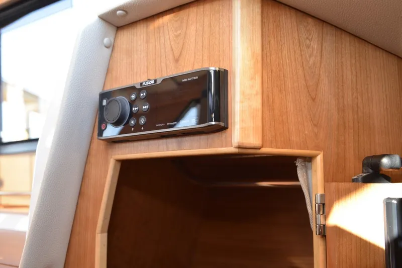 Slide: The Image of Fusion audio system in 2020 Cutwater C-30S boat interior, mounted on wooden panel. - 25