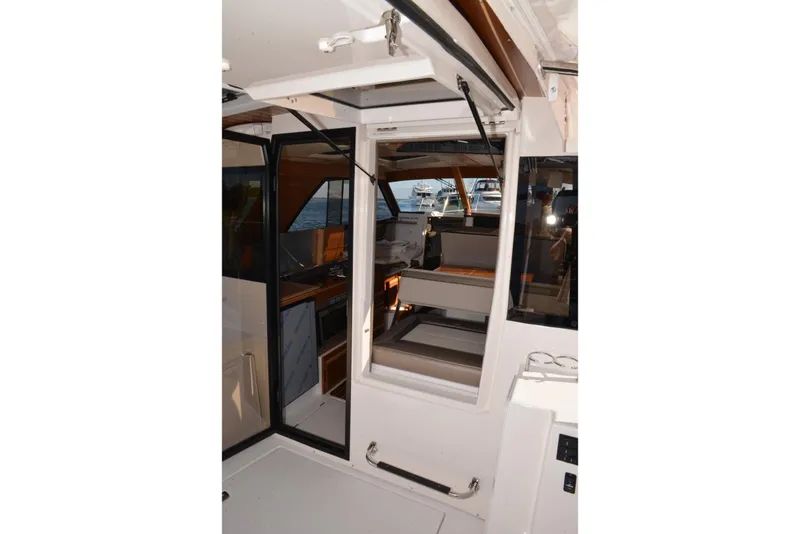 Slide: The Image of Interior view of 2020 Cutwater C-30S boat, showcasing seating and cabin area. - 33
