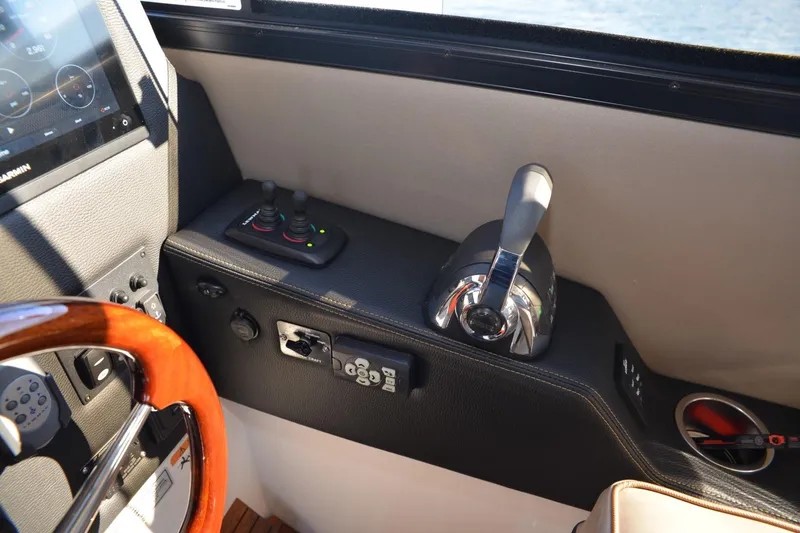 Slide: The Image of 2020 Cutwater C-30S helm with joystick controls and throttle lever. - 8