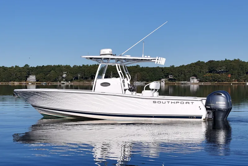 Slide: The Image of 2019 Southport 272 TE boat on calm water with Yamaha engine, clear sky background. - 1