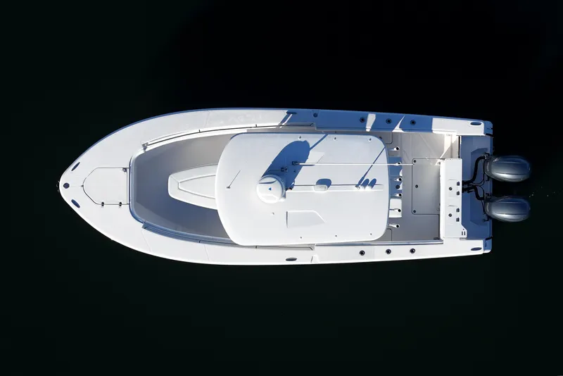 Slide: The Image of Overhead view of 2019 Southport 272 TE boat with dual engines on dark water. - 10