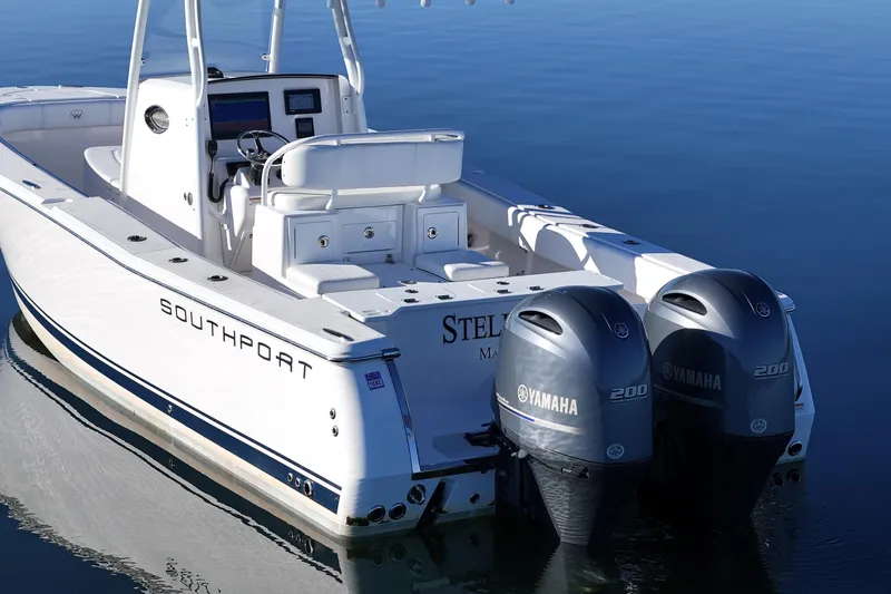 Slide: The Image of 2019 Southport 272 TE boat with twin Yamaha 200 engines on calm water. - 13