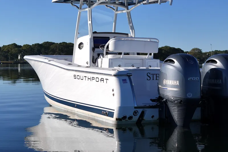Slide: The Image of 2019 Southport 272 TE boat with dual Yamaha engines on calm water. - 14