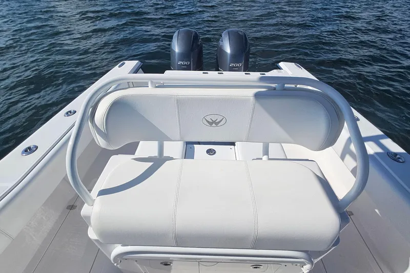 Slide: The Image of 2019 Southport 272 TE boat with dual engines and white seating on open water. - 21