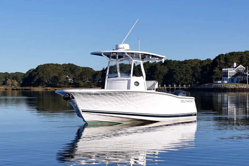 Slide: The Image of 2019 Southport 272 TE boat on calm water with scenic background. - 3