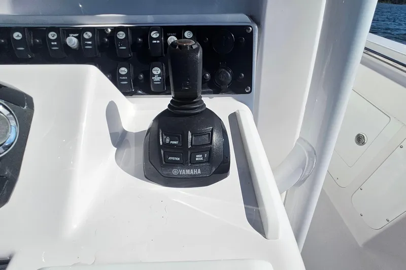 Slide: The Image of Yamaha joystick control on 2019 Southport 272 TE boat dashboard. - 30