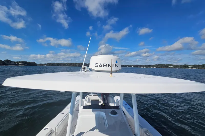 Slide: The Image of 2019 Southport 272 TE boat with Garmin radar on open water under blue sky. - 31