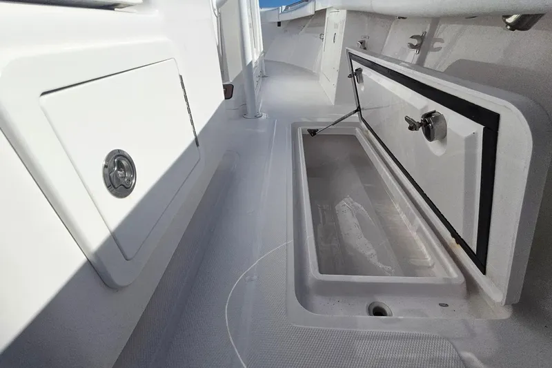 Slide: The Image of 2019 Southport 272 TE boat interior storage compartment with open hatch. - 35