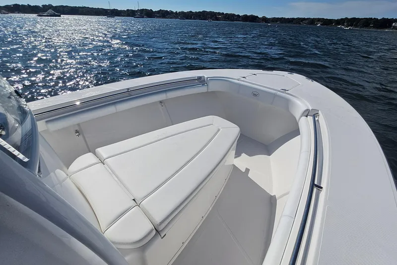 Slide: The Image of 2019 Southport 272 TE boat with white seating on a sunny day at sea. - 38