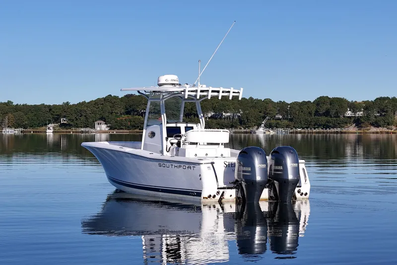 Slide: The Image of 2019 Southport 272 TE boat with dual Yamaha engines on calm water. - 4