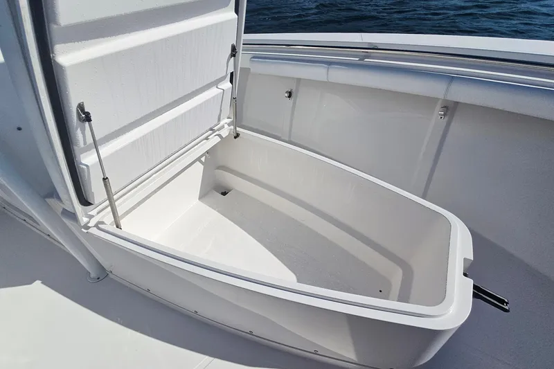 Slide: The Image of Open storage compartment on 2019 Southport 272 TE boat, showcasing spacious interior. - 40