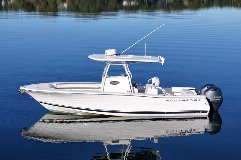Slide: The Image of 2019 Southport 272 TE boat on calm water, side view. - 6