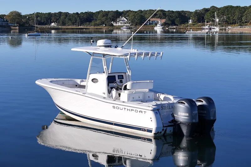 Slide: The Image of 2019 Southport 272 TE boat on calm water with twin Yamaha engines. - 8