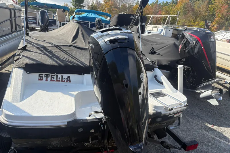 Slide: The Image of 2020 Tahoe T-16 boat named Stella with covered deck and outboard motor. - 11