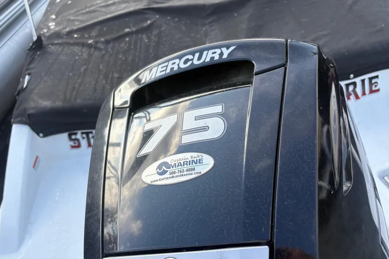 Slide: The Image of Mercury 75 outboard motor on 2020 Tahoe T-16 boat, featuring Captain Bub's Marine sticker. - 5