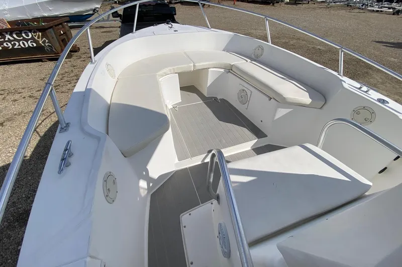 Slide: The Image of 2002 Mako 221 Center Console boat with spacious seating and sleek design. - 12