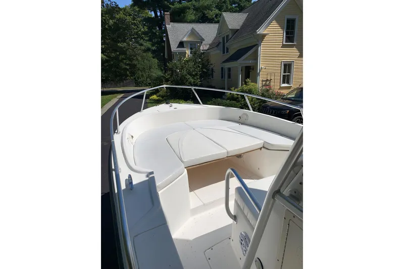 Slide: The Image of 2002 Mako 221 Center Console boat parked in residential driveway. - 13