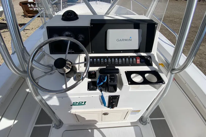 Slide: The Image of 2002 Mako 221 Center Console boat dashboard with Garmin navigation system. - 9