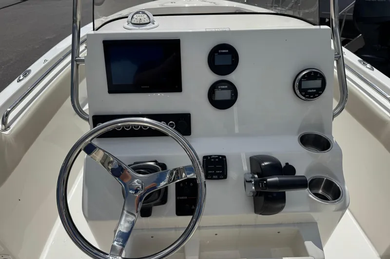 Slide: The Image of Steering console of 2026 Key West 203 FS boat with modern controls and gauges. - 13