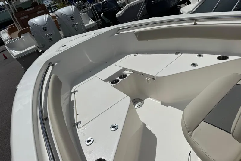 Slide: The Image of 2026 Key West 203 FS boat interior with seating and storage compartments. - 16