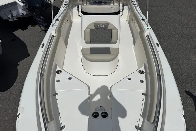 Slide: The Image of 2026 Key West 203 FS boat interior with cushioned seating and sleek design. - 17