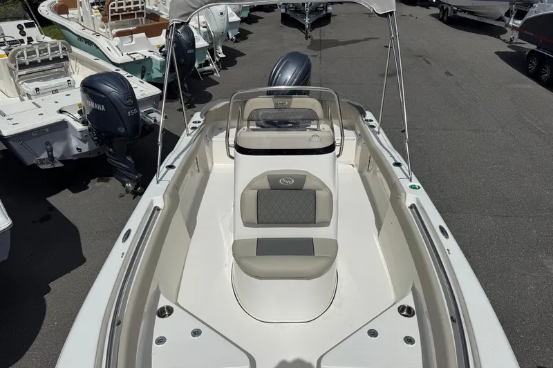 Slide: The Image of 2026 Key West 203 FS boat with Yamaha engine, docked among other boats. - 18
