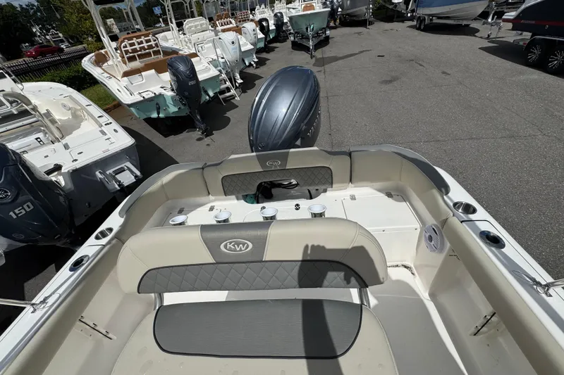 Slide: The Image of 2026 Key West 203 FS boat interior with seating and outboard motor. - 24