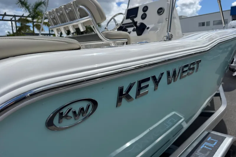 Slide: The Image of 2026 Key West 203 FS boat, sleek design, close-up view, sunny day. - 6