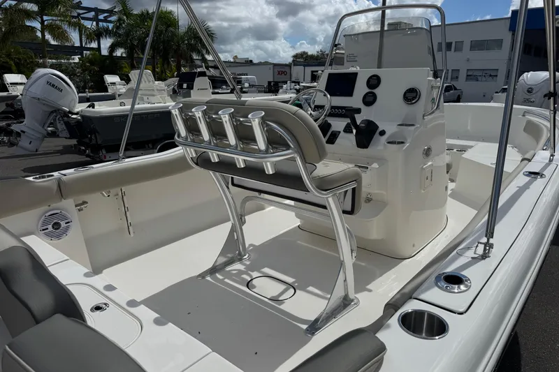 Slide: The Image of 2026 Key West 203 FS boat interior with console, seating, and rod holders. - 7