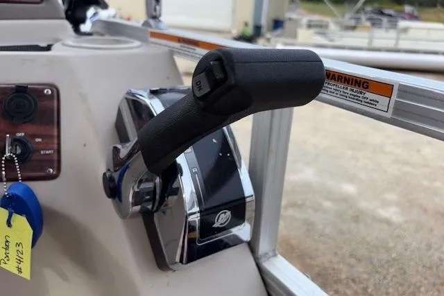 Slide: The Image of Throttle control of 2012 Tahoe Pontoon VT 2285 EL boat, featuring a sleek design. - 21
