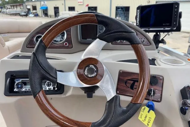Slide: The Image of Steering wheel of 2012 Tahoe Pontoon VT 2285 EL with dashboard and navigation system. - 22