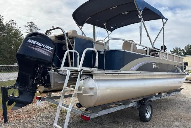 Slide: The Image of 2012 Tahoe Pontoon VT 2285 EL with Mercury outboard engine on trailer. - 7